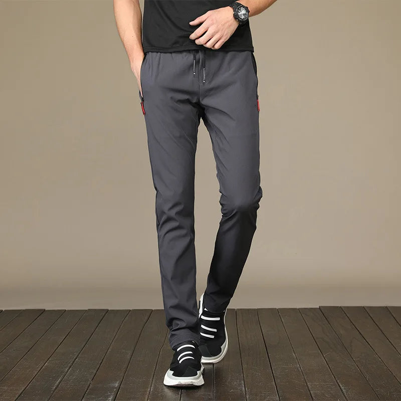 New Men Running Pants Ice silk elastic Breathable stripe Quick Dry Training Fitness Zip Pocket Joggings Pant Male Gym Sweatpants
